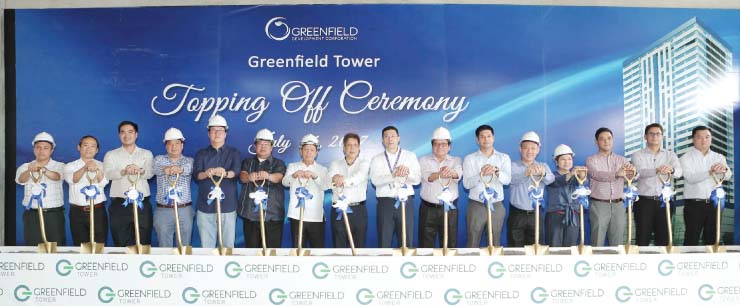 Greenfield District tops off two towers